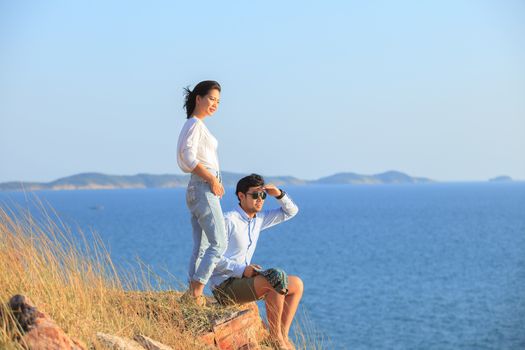 portrait of asian younger man and woman relaxing vacation at sea side happiness emotion