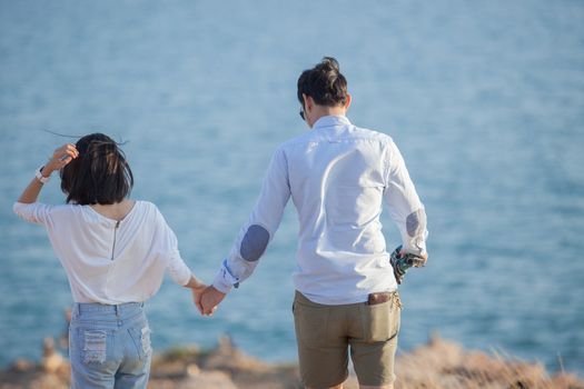 couples of younger man and woman in love relaxing vacation outdoor lifestyle 