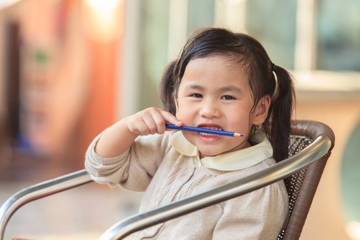 head shop photography of asian ,thai kid 4 years playing with happiness emotion at home