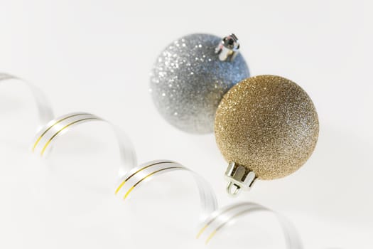 Christmas balls and ribbon on a white background