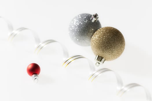 Christmas balls with ribbon on white background