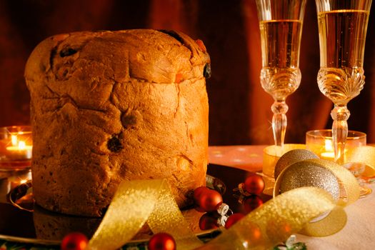 Closeup of Christmas cake and sparkling wine with Christmas decorations