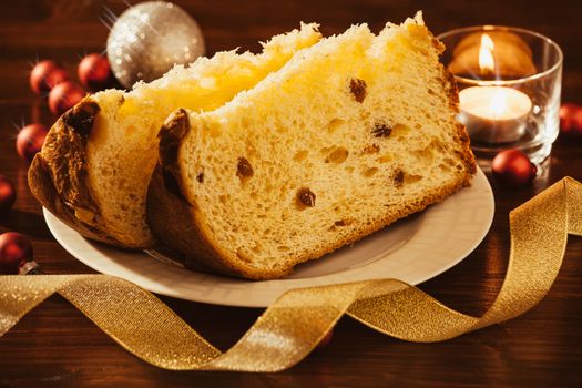 Closeup of sliced italian panettone with decorations