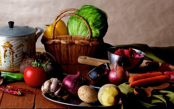 Arrangement of Raw Ingredients with Vegetables, Meat, Spices and Kitchen Dish Ware closeup on Wooden background. Dutch Still Life Styled