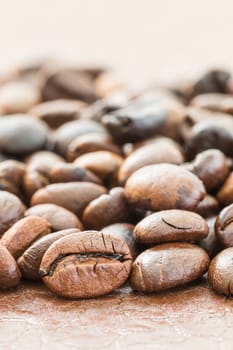 Close up heap of roasted brown coffee beans