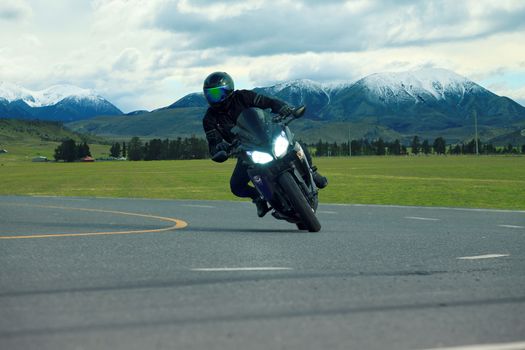 young man riding big bike motorcycle on asphalt highways use for people leisure vacation traveling and lifestyle activties