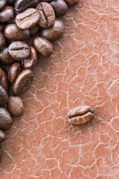 Top view close up brown roasted coffee beans background with copy space