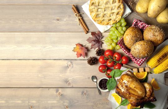 Thanksgiving savory and sweet food selection on top of a wooden background with copyspace 