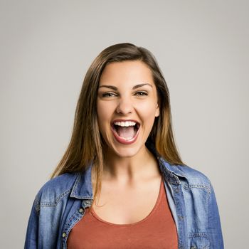 Portrait of a beautiful and happy woman laughing