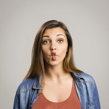 Portrait of a beautiful woman making a pout expression