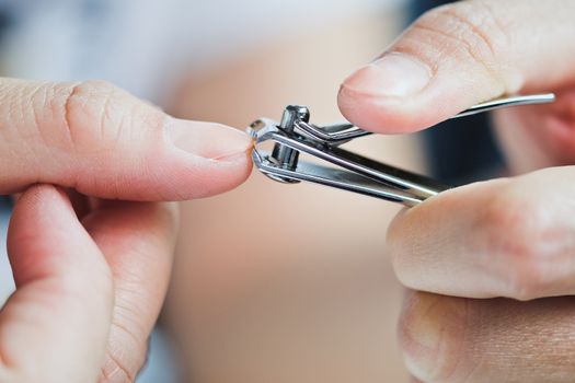 Cutting nails using nail clipper