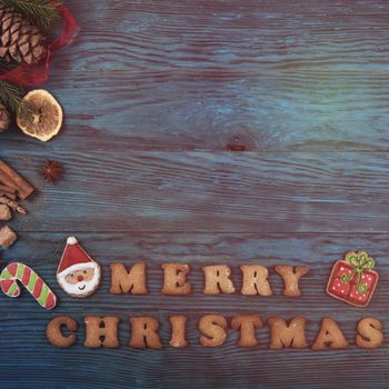 Gingerbreads for new years and christmas on wooden background, xmas theme