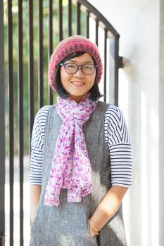 portrait of beautiful 40s years asian woman wearing wool hood and silk scarf toothy smiling with happiness face emotion 