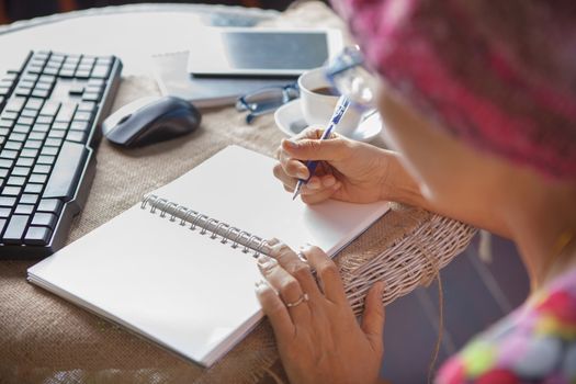 woman writing shot memories note on white paper with relaxing time and emotion