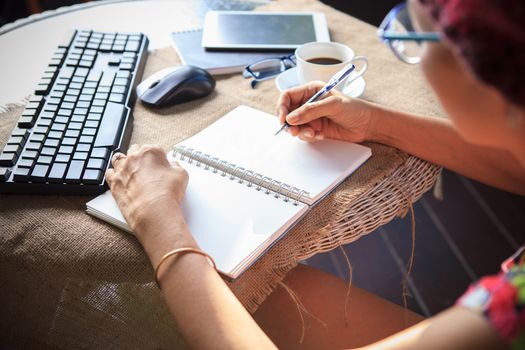 woman writing shot memories note on white paper with relaxing time and emotion