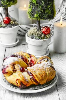 Christmas baked muffin in the background with candles