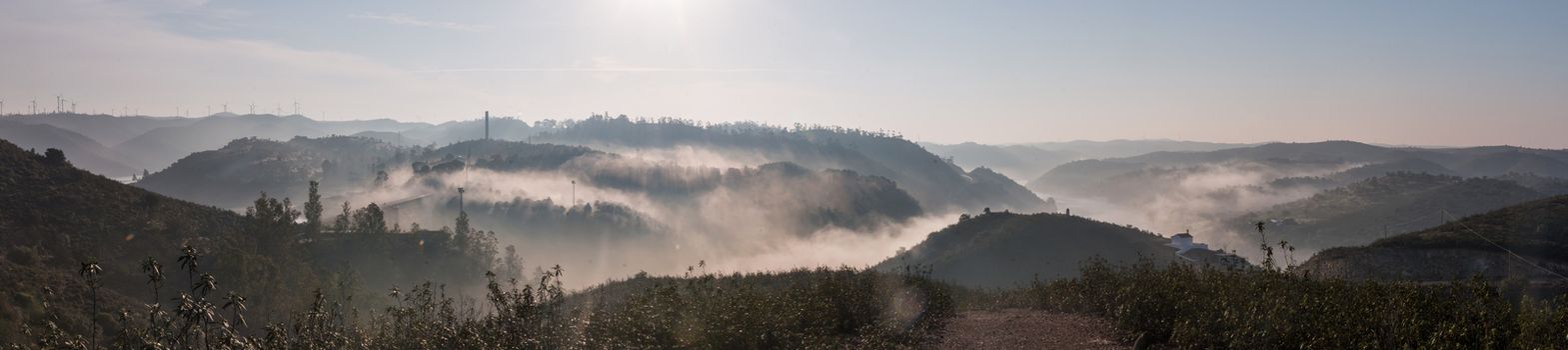 Foggy hills panorama  in the morning on the Algarve region.