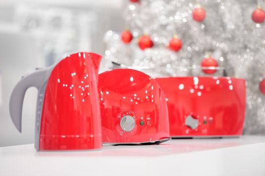 Red colored kettle and toasters in appliances store at Christmas