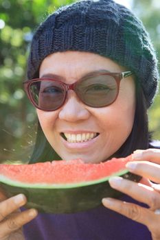 close up face of young woman with eating watermelon use for good healthy of human dental