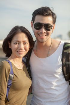 portrait couples of younger asian man and woman toothy smile with happiness face 