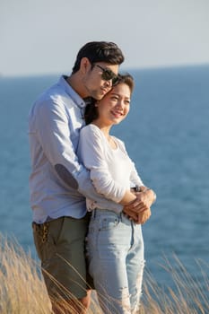 portrait of asian younger man and woman relaxing vacation at sea side happiness emotion