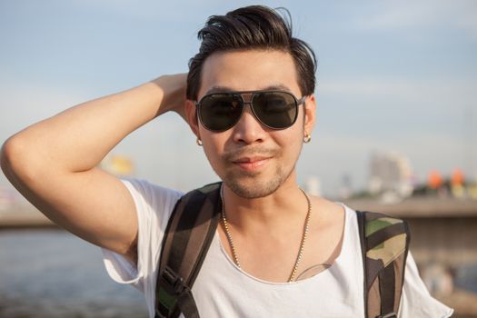 portrait head shot of asian man happy face