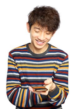 Young man using mobile phone texting on white background