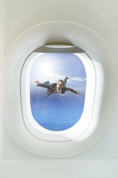 business man floating mid air out side passenger plane window 