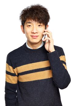 Happy young man talking on mobilephone, smiling happy, looking at camera.