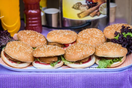 delicious burgers on the Board prinkled with sesame seeds