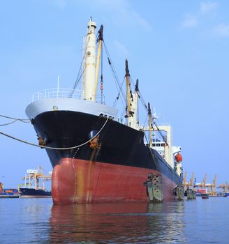 commercial container ship floating on river port use for import ,export and water transport topic