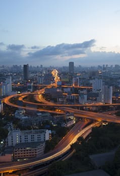 city scape and beautiful traffic light on expressways in heart of bangkok capital of thailand at dawn use for infra structure and land transport in large town