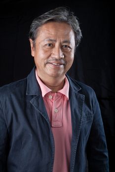 portrait head shot of smiling face with happiness emotion senior asian man with studio light 