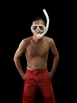 portrait face of young asian man wearing snorkel mask standing against black background with studio lighting 