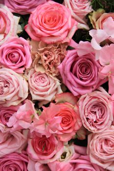 Lathyrus and roses in a pink wedding arrangement