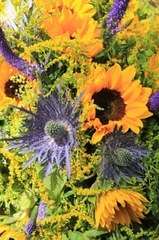 Blue and yellow wedding flowers: sunflowers and eryngium or sea holly