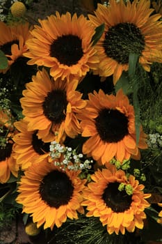 Big yellow sunflowers in a wedding floral arrangement