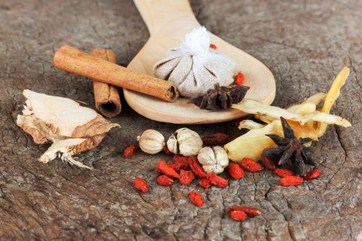 Spices chinese food and herbal wrap for stewed on old wood background