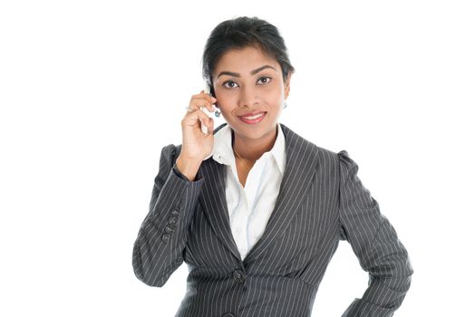 Black business woman calling on smartphone, looking at camera, isolated on white background.