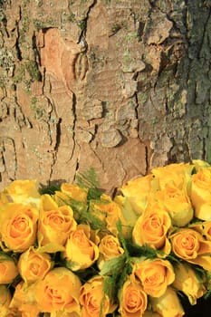 Yellow roses in a floral wedding arrangement