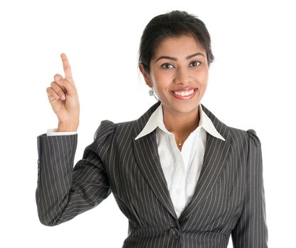 Portrait of black business woman in formalwear finger pointing at blank space, isolated on white background.