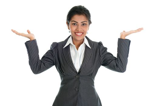 Black business woman in formalwear smiling and hands displaying something, isolated on white background.