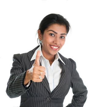 Black woman in formalwear giving a thumb up, isolated on white background.