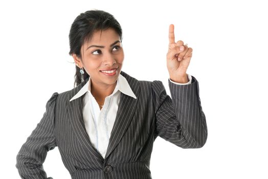 Black business woman in formalwear finger pointing at blank space, isolated on white background.