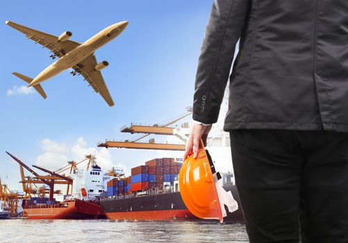 working man and commercial ship on port and air cargo plane flying above use for water and air transport,logistic import export industry