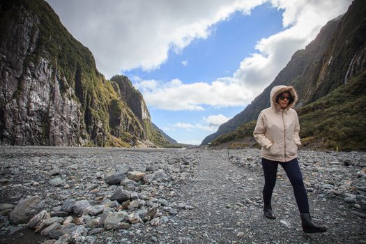 woman traveler walking in fox glacier trail important traveling destination in south island new zealand