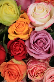 Multicolored roses in a colorful wedding arrangement