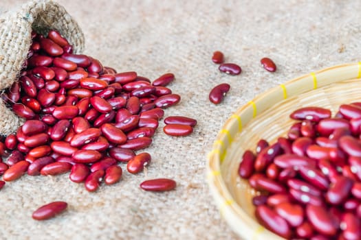 Dried red beans on a sack background