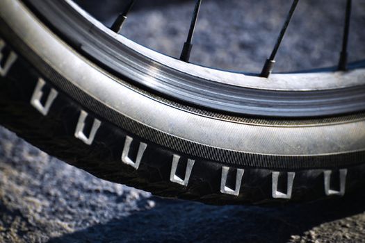detail wheel mountain bike with shadow underneath