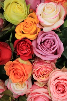 Multicolored roses in a colorful wedding arrangement